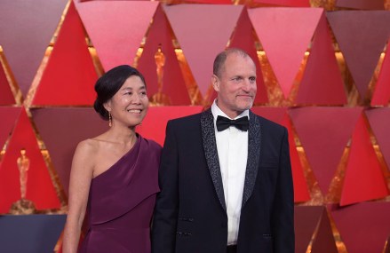Laura Louie, Woody Harrelson. Laura Louie, left, and Woody Harrelson arrive at the Oscars, at the Dolby Theatre in Los Angeles
90th Academy Awards - Arrivals, Los Angeles, USA - 04 Mar 2018