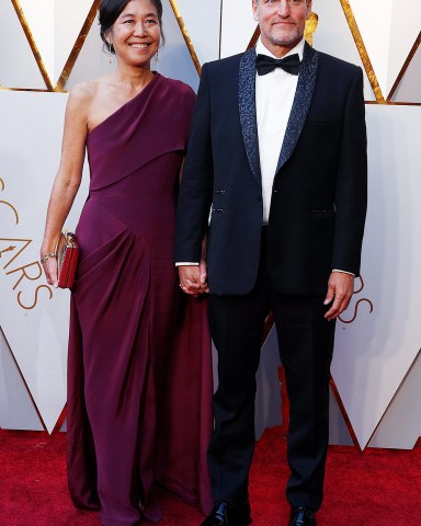 Woody Harrelson (R) and Laura Louie arrive for the 90th annual Academy Awards ceremony at the Dolby Theatre in Hollywood, California, USA, 04 March 2018. The Oscars are presented for outstanding individual or collective efforts in 24 categories in filmmaking.Arrivals - 90th Academy Awards, Hollywood, USA - 04 Mar 2018