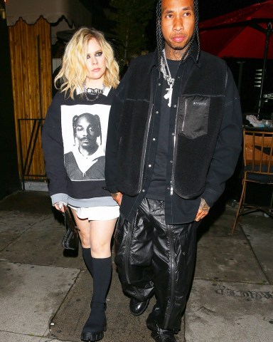West Hollywood, CA  - *EXCLUSIVE*  - New couple Avril Lavigne and Tyga walk hand in hand while leaving Kyrie Irving's birthday party at The Nice Guy nightclub in West Hollywood. Also Alexander Edwards was with there without Cher!Pictured: Avril Lavigne, TygaBACKGRID USA 23 MARCH 2023 USA: +1 310 798 9111 / usasales@backgrid.comUK: +44 208 344 2007 / uksales@backgrid.com*UK Clients - Pictures Containing ChildrenPlease Pixelate Face Prior To Publication*