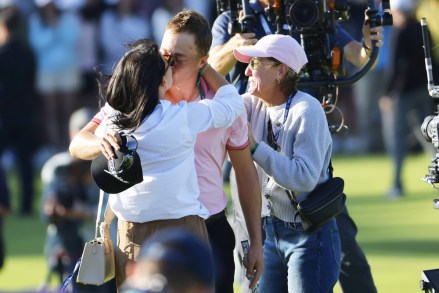 Justin Thomas of the USA (C) receives a kiss from finacee, Jillian Wisniewski (L) as his mother, Jani (R) looks on after his winning putt in the playoff round against Will Zalatoris of the USA during the final round of the USA during the final round of the 2022 PGA Championship golf tournament at the Southern Hills Country Club in Tulsa, Oklahoma, USA, 22 May 2022.
2022 PGA Championship golf tournament, Tulsa, USA - 22 May 2022