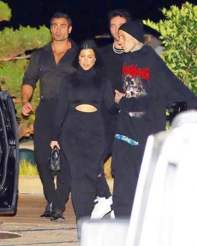 Kourtney Kardashian and Travis Barker are seen leaving Nobu Malibu. 20 Sep 2022 Pictured: Kourtney Kardashian and Travis Barker. Photo credit: MEGA TheMegaAgency.com +1 888 505 6342 (Mega Agency TagID: MEGA899885_004.jpg) [Photo via Mega Agency]