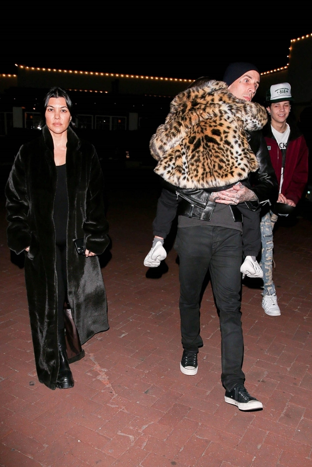Kourtney Kardashian steps out in chic fur coat as she and Travis
