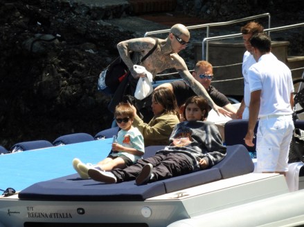 EXCLUSIVE: Kourtney Kardashian and Travis Barker seen in a boat, the day before their Italian wedding in Portofino. 20 May 2022 Pictured: Kourtney Kardashian, Travis Barker. Photo credit: MEGA TheMegaAgency.com +1 888 505 6342 (Mega Agency TagID: MEGA859696_004.jpg) [Photo via Mega Agency]