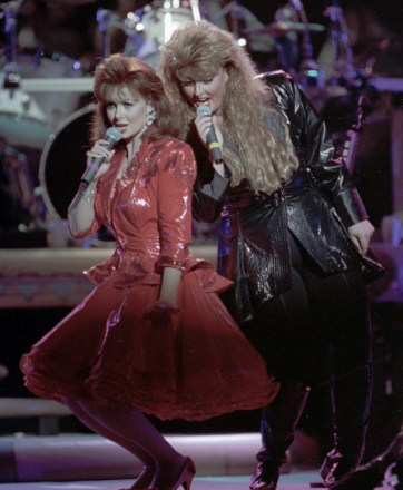 JUDD Naomi Judd, left, and daughter Wynonna perform their farewell concert Wednesday night in Murfreesboro, Tennessee.  Naomi leaves the successful country duo due to chronic hepatitis THE JUDDS, MURFREESBORO, USA