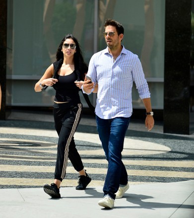 EXCLUSIVE: Despite the 24 year age gap, Mick Jagger's former fling Noor Alfallah enjoys a romantic lunch with new beau Eli Roth as the pair are spotted leaving Avra Estiatorio in Beverly Hills. 20 Aug 2018 Pictured: Eli Roth, Noor Alfallah. Photo credit: MEGA TheMegaAgency.com +1 888 505 6342 (Mega Agency TagID: MEGA264638_004.jpg) [Photo via Mega Agency]
