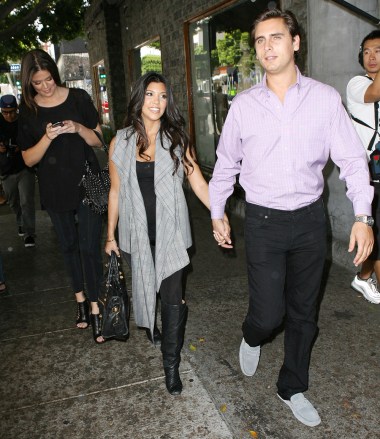 Kourtney Kardashian, Chloe Kardashian, Scott Disick Chloe and Courtney Kardashian enter and leave Beverly Hills, Los Angeles, USA-September 22, 2009 Sisters Chloe and Pleasures Courtney Kardashian and Court's boyfriend Scott Disick With a happy face on the camera, some goofy hats while shooting a new scene for a reality show at 