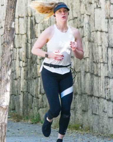 EXCLUSIVE: Amber Heard seen going for a run near her now home in Madrid, Spain. 05 May 2023 Pictured: Amber Heard. Photo credit: MEGA TheMegaAgency.com +1 888 505 6342 (Mega Agency TagID: MEGA979387_024.jpg) [Photo via Mega Agency]