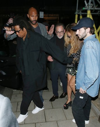 London, UNITED KINGDOM  - *EXCLUSIVE*  - Jay Z and Beyoncé make a stylish exit from Harry's Bar in Mayfair, accompanied by tight security, as billionaire businessman and Aston Villa FC chairman Nassef Sawiris joins the power couple. Inside sources reveal that Beyoncé indulged in a delectable soufflé during their visit.Pictured: Jay Z, Beyonce KnowlesBACKGRID USA 19 MAY 2023 BYLINE MUST READ: Click News and Media / BACKGRIDUSA: +1 310 798 9111 / usasales@backgrid.comUK: +44 208 344 2007 / uksales@backgrid.com*UK Clients - Pictures Containing ChildrenPlease Pixelate Face Prior To Publication*