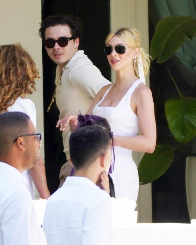 Newlyweds Brooklyn and Nicola Peltz look radiant as they step out for brunch on Sunday the day after their flashy Palm Beach nuptials. Husband and wife were seen at the Peltz familys stunning Florida pad on day three of the star-studded wedding extravaganza. The bride wore a white dress and matching ribbon in her flowing blonde ponytail while Brooklyn looked dapper in cream knitted shirt.Their romantic outing came as a lavish brunch was being held at a huge marquee set up in sprawling tropical gardens out back of the Peltz residence.David and Victorias eldest son and actress Nicola tied the knot at her ultra wealthy familys USD 76 million oceanfront estate.Pictured: Brooklyn Beckham,Nicola PeltzRef: SPL5302812 100422 NON-EXCLUSIVEPicture by: RM / SplashNews.comSplash News and PicturesUSA: +1 310-525-5808London: +44 (0)20 8126 1009Berlin: +49 175 3764 166photodesk@splashnews.comWorld Rights
