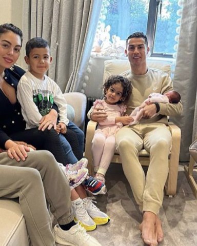 Manchester United star Cristiano Ronaldo shared a social media update on Thursday April 21, 2022 shortly after their baby girl made the journey back from hospital following her birth on Monday April 18, 2022. However a statement released on Monday confirmed one of the couple's twins had died, with Ronaldo describing the loss as 'the greatest pain'. Ronaldo, 37, cradled his daughter while accompanied by Spanish partner Georgina and their four children - three of which the footballer fathered through surrogates. Cristiano Ronaldo shares Family photo with New Born Baby Girl, Manchester, UK - 21 Apr 2022