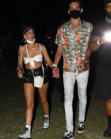 Indio, CA  - *EXCLUSIVE*  - Halsey and her boyfriend G-Eazy hold hands arriving for the evening Coachella. The pair wore face masks to combat the desert dust, although the singer did sneak in a quick smoke.

Pictured: Halsey, G-Eazy

BACKGRID USA 15 APRIL 2018 

USA: +1 310 798 9111 / usasales@backgrid.com

UK: +44 208 344 2007 / uksales@backgrid.com

*UK Clients - Pictures Containing Children
Please Pixelate Face Prior To Publication*