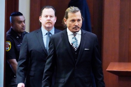 Actor Johnny Depp walks into the courtroom after a break at the Fairfax County Circuit Courthouse in Fairfax, Virginia, USA, 18 April 2022. Johnny Depp's 50 million US dollars defamation lawsuit against Amber Heard that started on 10 April is expected to last five or six weeks.
Depp v Heard defamation lawsuit at the Fairfax County Circuit Court, USA - 18 Apr 2022
