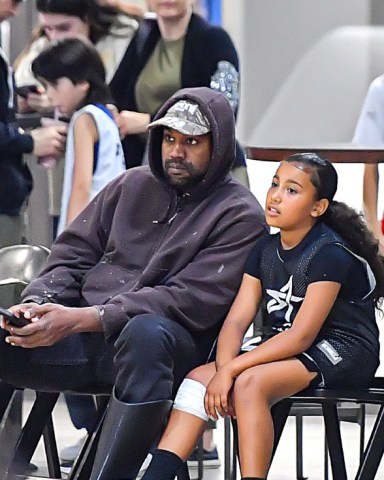 Kanye West & Daughter North West Were Spotted Sitting Court side At Her Basketball Game In Thousand Oaks, CA. The Two Were Seen Bonding In Between Breaks Of Her Game. 21 Oct 2022 Pictured: Kanye West & Daughter North West Were Spotted Sitting Court side At Her Basketball Game In Thousand Oaks, CA. The Two Were Seen Bonding In Between Breaks Of Her Game. Photo credit: @CelebCandidly / MEGA TheMegaAgency.com +1 888 505 6342 (Mega Agency TagID: MEGA910307_001.jpg) [Photo via Mega Agency]