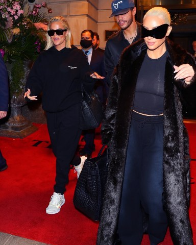 New York, NY  - Kim Kardashian, Khloe Kardashian, and Pete Davidson check out of their hotel after attending the Met Gala. The trio were seen leaving their hotel after slipping out of their MET Gala looks and into some comfy travel clothes. Their security even carried a box of treats from Doughnuttery.  Pictured: Khloe Kardashian, Pete Davidson, Kim Kardashian  BACKGRID USA 3 MAY 2022   BYLINE MUST READ: BlayzenPhotos / BACKGRID  USA: +1 310 798 9111 / usasales@backgrid.com  UK: +44 208 344 2007 / uksales@backgrid.com  *UK Clients - Pictures Containing Children Please Pixelate Face Prior To Publication*
