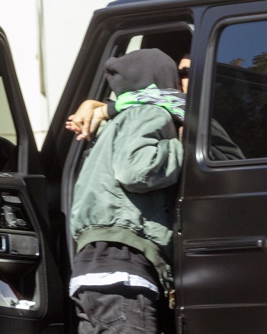 Calabasas, CA  - *EXCLUSIVE*  - Kourtney Kardashian and husband Travis Barker refuse to let a moment go by where they're not locked up in an embrace. The lovebirds met up in Calabasas for some PDA before Travis heads to the studio. Kourtney steps out of her car to snap some pics of the skeleton that Travis has in his truck.Pictured: Kourtney Kardashian, Travis BarkerBACKGRID USA 26 OCTOBER 2022 USA: +1 310 798 9111 / usasales@backgrid.comUK: +44 208 344 2007 / uksales@backgrid.com*UK Clients - Pictures Containing ChildrenPlease Pixelate Face Prior To Publication*