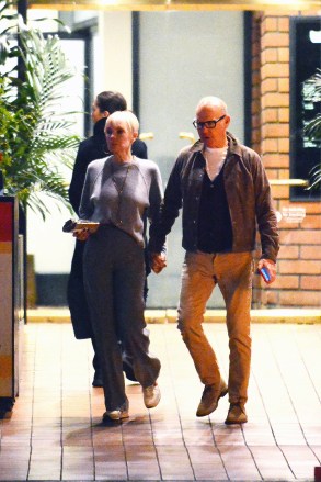 EXCLUSIVE: Michael Keaton and girlfriend Marni Turner leave Toscana restaurant in Brentwood. 8th December 2022 Pictured: Michael Keaton and girlfriend Marni Turner leave Toscana restaurant in Brentwood Photo Credit: MEGA TheMegaAgency.com +1 888 505 6342 (Mega Agency TagID: MEGA924778_001.jpg) [Photo via Mega Agency]