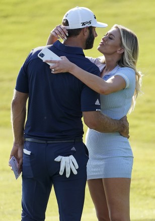 Dustin Johnson celebrates with his partner Paulina Gretzky on the 18th green after winning the Tour Championship golf tournament and FedEx Cup on at East Lake Golf Club in Atlanta
Tour Championship Golf, Atlanta, United States - 07 Sep 2020