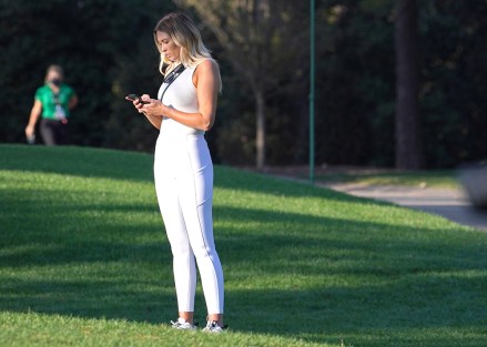 Paulina Gretzky, partner of pro golfer Dustin Johnson, checks her cell phone during the third round of the 2020 Masters golf tournament at Augusta National Golf Club in Augusta, Georgia on Saturday, November 14, 2020.
Masters 2020, Augusta, Georgia, United States - 14 Nov 2020