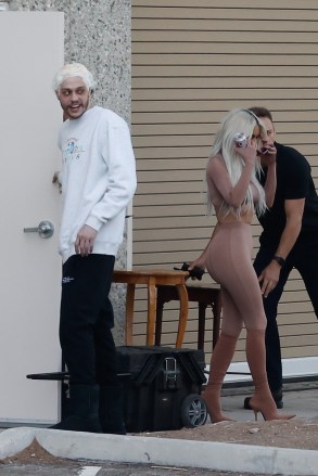 Calabasas, CA - *EXCLUSIVE* - Pete Davidson is seen for the first time since leaving SNL with girlfriend Kim Kardashian during what looks like a photoshoot at his office in Calabasas on Friday.  Peter was spotted wearing a shower cap covering his bleached hair while giving his girlfriend Kim a thumbs up on her photoshoot.Pictured: Kim Kardashian, Pete DavidsonBACKGRID USA MAY 28, 2022 USA: +1 310 798 9111 / usasales @backgrid.comUK: +44 208 344 2007 / uksales@backgrid.com*UK Customers - Images containing childrenPlease rasterize face before posting*