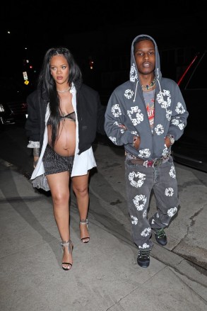Santa Monica, CA - Pregnant Rihanna and ASAP Rocky hold hands as they head to the Giorgio Baldi restaurant for her baby day dinner with family and friends in Santa Monica.  Pictured: Rihanna, ASAP Rocky BACKGRID USA 24 APRIL 2022 USA: +1 310 798 9111 / usasales@backgrid.com UK: +44 208 344 2007 / uksales@backgrid.com * UK customers - Please photos, containing Face for children *
