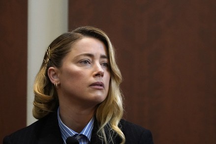 Actress Amber Heard reacts as she testifies during the Depp v Heard defamation case at Fairfax County Circuit Court, in Fairfax, Virginia, USA, 04 May 2022. US actor Johnny Depp sued his ex-wife US actress Amber Heard for libel in Fairfax County Circuit Court after she wrote an op-ed piece in The Washington Post in 2018 referring to herself as a 'public figure representing domestic abuse.'  Depp v Heard defamation lawsuit at County Circuit Court in Fairfax, USA - 04 May 2022