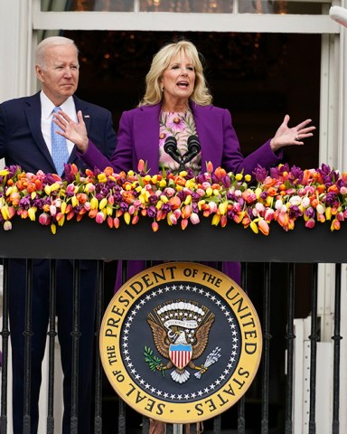 First lady Jill Biden speaks as President Joe Biden and the Easter Bunnies look, on the Blue Room balcony at the White House during the White House Easter Egg Roll, in Washington
Biden Egg Roll, Washington, United States - 18 Apr 2022