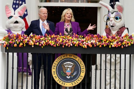First lady Jill Biden speaks as President Joe Biden and the Easter Bunnies look, on the Blue Room balcony at the White House during the White House Easter Egg Roll, in Washington
Biden Egg Roll, Washington, United States - 18 Apr 2022