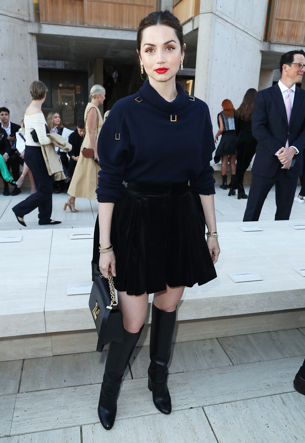 Ana de Armas is Preppy-Chic in Sweater, Velvet Mini Skirt & Knee-High Boots  at Louis Vuitton Cruise 2023 Show