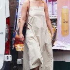 Jennifer Lawrence steps out with small umbrella after spending an hour at a tanning salon in NYC