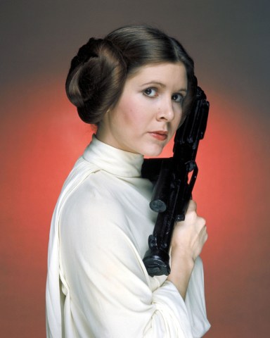 Editorial use only. No book cover usage.Mandatory Credit: Photo by Lucasfilm/Fox/Kobal/Shutterstock (5886297ew)Carrie FisherStar Wars Episode IV - A New Hope - 1977Director: George LucasLucasfilm/20th Century FoxUSAFilm PortraitScifiStar Wars (1977)La Guerre des étoiles