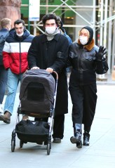 Chloe Sevigny and partner Sinisa Mackovic are all smiles while bundled up for the cold winter weather during a happy stroll with their baby in Manhattan's Downtown area. 29 Dec 2020 Pictured: Chloe Sevigny and Sinisa Mackovic. Photo credit: LRNYC / MEGA TheMegaAgency.com +1 888 505 6342 (Mega Agency TagID: MEGA723406_001.jpg) [Photo via Mega Agency]