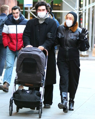 Chloe Sevigny and partner Sinisa Mackovic are all smiles while bundled up for the cold winter weather during a happy stroll with their baby in Manhattan's Downtown area. 29 Dec 2020 Pictured: Chloe Sevigny and Sinisa Mackovic. Photo credit: LRNYC / MEGA TheMegaAgency.com +1 888 505 6342 (Mega Agency TagID: MEGA723406_001.jpg) [Photo via Mega Agency]