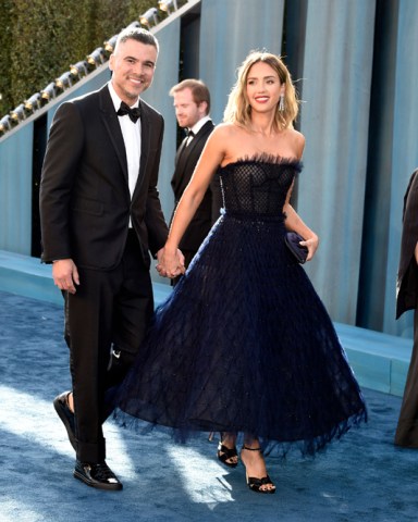 Cash Warren, left, and Jessica Alba arrive at the Vanity Fair Oscar Party, at the Wallis Annenberg Center for the Performing Arts in Beverly Hills, Calif 94th Academy Awards - Vanity Fair Oscar Party, Beverly Hills, United States - 27 Mar 2022