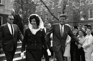 John F. Kennedy, Jacqueline Kennedy President John F. Kennedy and first lady Jacqueline Kennedy leave Holy Trinity Catholic Church in Georgetown, Washington, after attending Mass. Mrs. Kennedy wears a while mantilla to cover her head
JFK And Jackie, Washington, USA