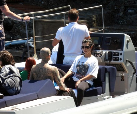EXCLUSIVE: Kourtney Kardashian and Travis Barker seen in a boat, the day before their Italian wedding in Portofino.  May 20, 2022 Pictured: Kourtney Kardashian, Travis Barker.  Photo credit: MEGA TheMegaAgency.com +1 888 505 6342 (Mega Agency TagID: MEGA859696_015.jpg) [Photo via Mega Agency]