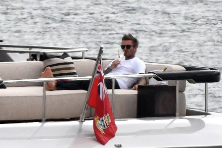 EXCLUSIVE: David Beckham puts his feet up and sips rose wine as he relaxes on his yacht "Seven" with pal David Gardner in Miami. One day before the Inter Miami season opener, the two best buddies were seen drinking Miraval rose wine while relaxing in the bay while Harper Beckham made herself at home on the boat she shares a middle name with. 25 Feb 2022 Pictured: David Beckham; David Gardner. Photo credit: MEGA TheMegaAgency.com +1 888 505 6342 (Mega Agency TagID: MEGA831796_002.jpg) [Photo via Mega Agency]