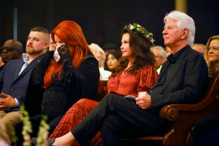 NASHVILLE, TENNESSEE - MAY 15: Wynonna Judd, Ashley Judd, and Larry Strickland attend CMT and Sandbox Live's "Naomi Judd: A River Of Time Celebration" at Ryman Auditorium on May 15, 2022 in Nashville, Tennessee. (Photo by Katie Kauss/Getty Images for CMT)
