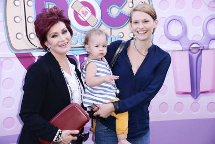 Sharon Osbourne, Pearl Osbourne, Lisa Stelly;  Disney 'Doc Mcstuffins' event, Los Angeles, America - 26 Sep 2013 Green carpet for the Health-Focused "Doc Mobile" Tour For Kids And Families held at the Grove in Los Angeles