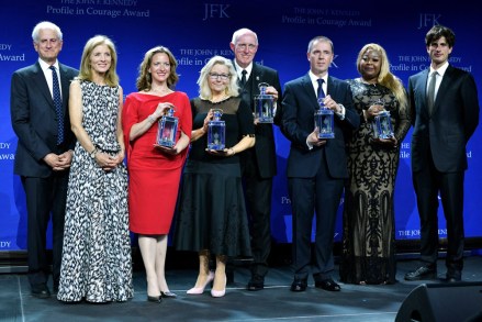 The 2022 John F. Kennedy Profile in Courage Award recipients, holding their awards, from left, Michigan Secretary of State Jocelyn Benson, U.S. Rep. Liz Cheney, R-Wyo., U.S. Rep Russell "Rusty" Bowers, R-Ariz., Yaroslav Brisiuck, Deputy Chief of Misssion at the Embassy of Ukraine, accepting on behalf of Ukrainian President Volodymyr Zelenskyy, and Wandrea' "Shaye" Moss, former Fulton County, Georgia, election worker, are flanked by, from left, Ed Schlossberg, his wife, Ambassador Caroline Kennedy, and son Jack Schlossberg, at the John F. Kennedy Presidential Library and Museum in Boston
Profile in Courage - Cheney, Boston, United States - 22 May 2022