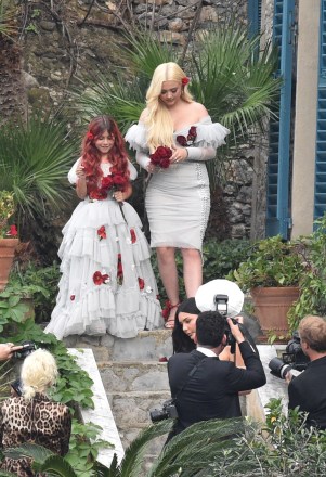 portofino, ITALY - * EXCLUSIVE * - Here Comes the Bride !!  Kourtney Kardashian is seen being guided to her wedding by mother Kris.  Pictured: bridesmaids BACKGRID USA 22 MAY 2022 BYLINE MUST READ: Cobra Team / BACKGRID USA: +1 310 798 9111 / usasales@backgrid.com UK: +44 208 344 2007 / uksales@backgrid.com * UK Clients - Pictures Containing Children Please Pixelate Face Prior To Publication *