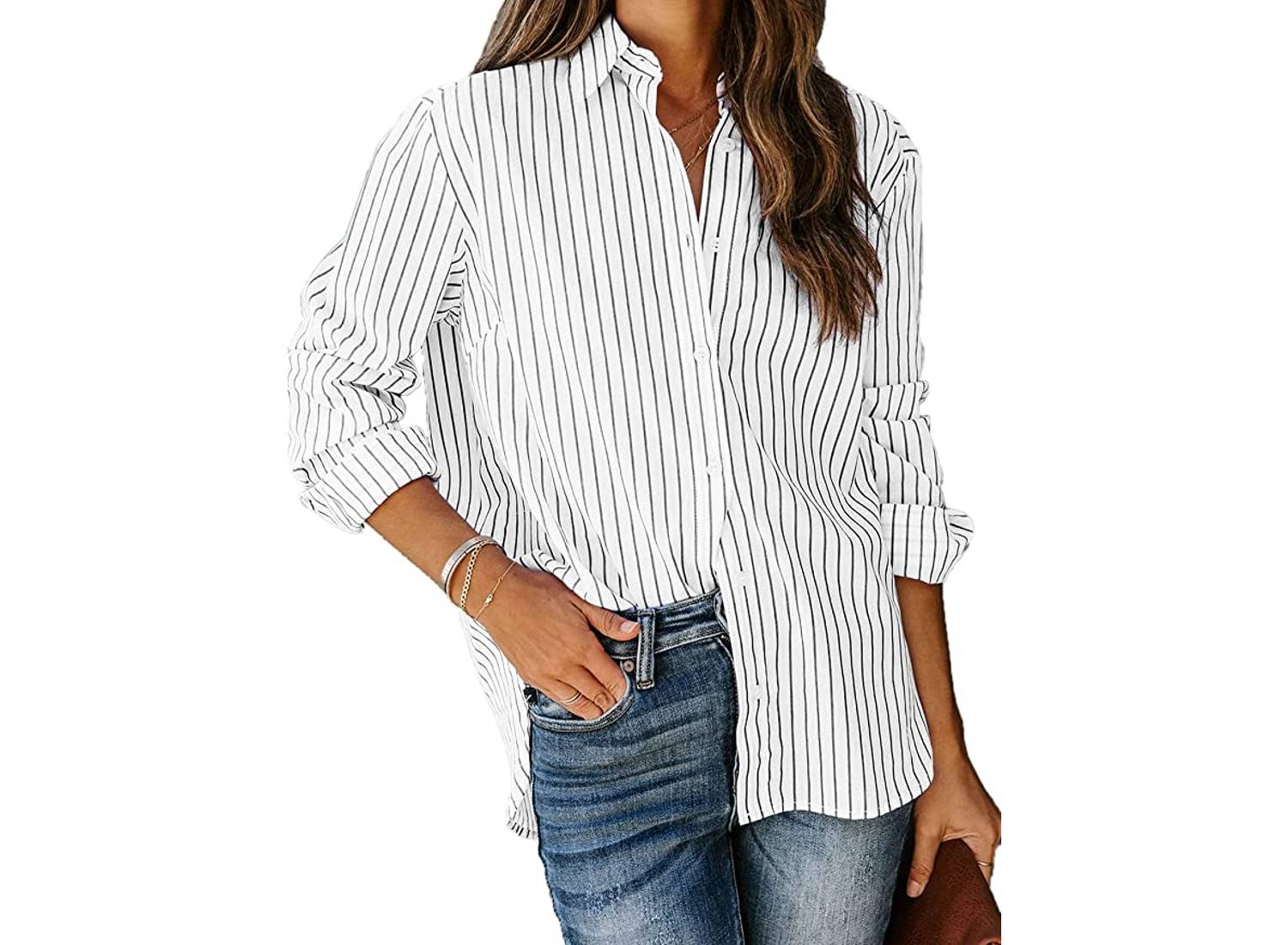 Woman wearing white button-up shirt with black pinstripes and a pair of jeans