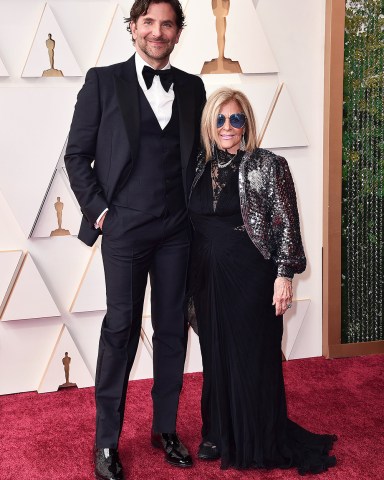 Bradley Cooper, left, and Gloria Campano arrive at the Oscars, at the Dolby Theatre in Los Angeles
94th Academy Awards - Arrivals, Los Angeles, United States - 27 Mar 2022