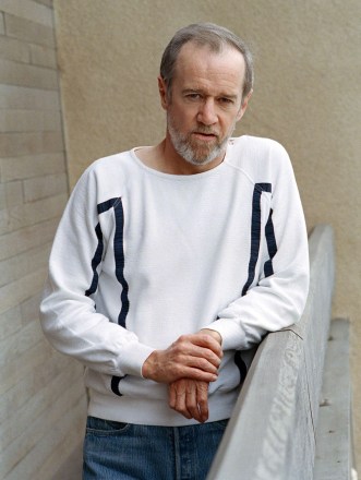 Comedian George Carlin pictured at his Brentwood, Ca., office, demonstrates his long-deferred acting ambition in his newest special for Home Box Office and in a movie now in production
George Carlin, Brentwood, USA