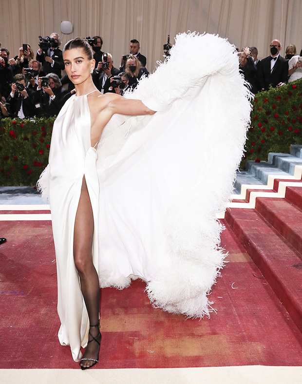 Hailey Bieber Echoes Disco Glamour In Satin White Dress With Feathers