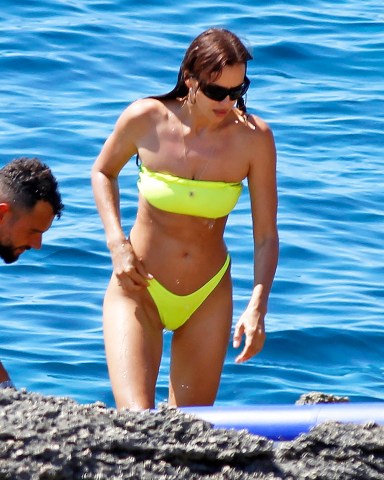 EXCLUSIVE: Irina Shayk photographed in green bikini in ibiza whilst taking a swim with a large group of friends who were celebrating friend Riccardo Tisci's birthday at hotel resort Six Senses. 04 Aug 2022 Pictured: Irina Shayk. Photo credit: Elkin Cabarcas / MEGA TheMegaAgency.com +1 888 505 6342 (Mega Agency TagID: MEGA883852_001.jpg) [Photo via Mega Agency]