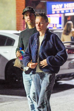 EXCLUSIVE: Kate Bosworth and her beau Justin Long step out in Pasadena after sparking engagement rumors over the weekend. The couple were seen heading to a sushi restaurant. Kate wore an oversized sweater and jeans and kept her look incognito with a black facemask. Justin was all smiles and put his arm around his lady as they stepped out on the town. 15 Mar 2023 Pictured: Kate Bosworth and Justin Long. Photo credit: MEGA TheMegaAgency.com +1 888 505 6342 (Mega Agency TagID: MEGA956730_022.jpg) [Photo via Mega Agency]