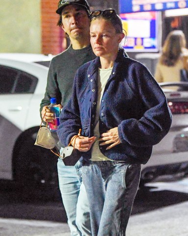 EXCLUSIVE: Kate Bosworth and her beau Justin Long step out in Pasadena after sparking engagement rumors over the weekend. The couple were seen heading to a sushi restaurant. Kate wore an oversized sweater and jeans and kept her look incognito with a black facemask. Justin was all smiles and put his arm around his lady as they stepped out on the town. 15 Mar 2023 Pictured: Kate Bosworth and Justin Long. Photo credit: MEGA TheMegaAgency.com +1 888 505 6342 (Mega Agency TagID: MEGA956730_022.jpg) [Photo via Mega Agency]