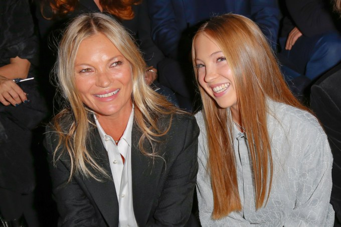 Kate Moss and Lila Grace Moss watch the runway