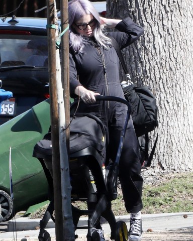 Los Angeles, CA  - *EXCLUSIVE*  - Kelly Osbourne is getting all the help she can get as she steps out with newborn baby Sidney in Los Angeles. Kelly has a friend who helped load Sidney's car seat in Kelly's ride after she attended a newborn baby support group.Pictured: Kelly OsbourneBACKGRID USA 15 FEBRUARY 2023 BYLINE MUST READ: Stefan / BACKGRIDUSA: +1 310 798 9111 / usasales@backgrid.comUK: +44 208 344 2007 / uksales@backgrid.com*UK Clients - Pictures Containing ChildrenPlease Pixelate Face Prior To Publication*