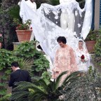 *EXCLUSIVE* Kourtney Kardashian is seen being guided to her wedding by mother Kris.